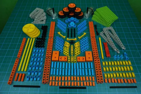 Construction kit pieces: beams, gears, wheels and connectors in many colours