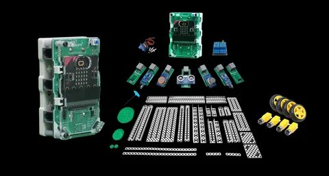 Ultima Kit laid out: the controller in its case, sensor modules, motors, wheels and chassis plates