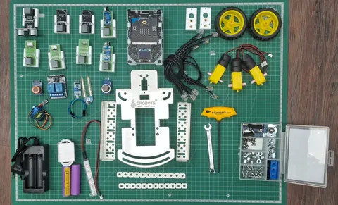 Ultima Lite kit laid out: controller, sensors, motors, wheels and chassis parts